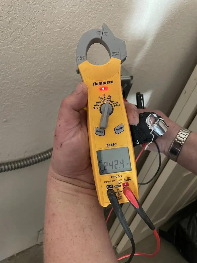 Voltage testing with clamp meter during Electrical Installation Services in Palmer Ranch